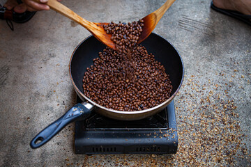 Traditional roasting coffee at home,  freshly roasted coffee beans.