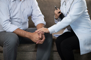 psychiatris or doctor hold hands psychosis patient