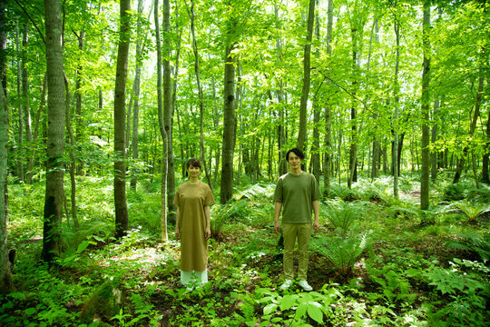 Mature Man and Woman Standing in the Forest