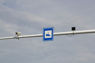 Traffic camera and sign on a city street in northeastern China.