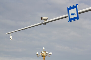 Fototapeta na wymiar Traffic cameras and sign on a city street in northeastern China.