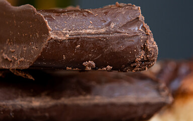 Exquisite pieces of freshly made chocolate with black background and close up.