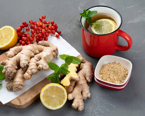 Ginger root with tea and lemon