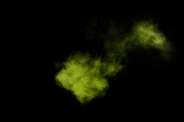 Light green powder explosion on black background. Colored powder cloud. Colorful dust explode. Paint  Holi.