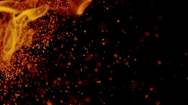 Fire flames with sparkles shooting on high speed camera at 1000fps, Isolated on black background.