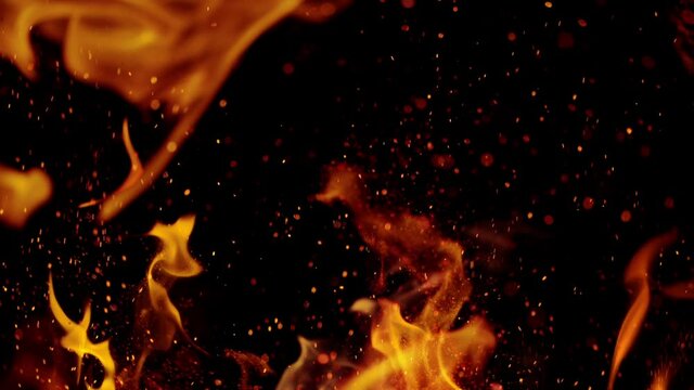 Fire flames with sparkles shooting on high speed camera at 1000fps, Isolated on black background.