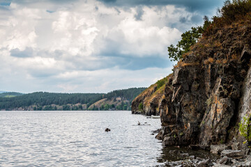 The rocky shore of a picturesque lake