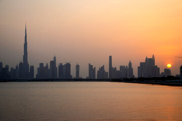 Fototapeta premium Sunset over a skyline of a beautiful city of Dubai. UAE.