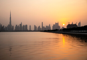 Fototapeta na wymiar Sunset over a skyline of a beautiful city of Dubai. UAE.