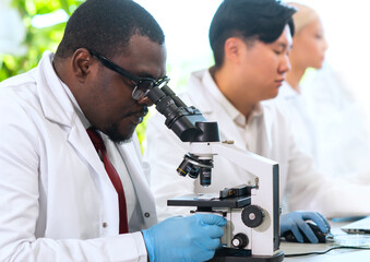 Scientist and students working in lab. Doctor teaching interns to make analyzing research. Biotechnology, chemistry, bacteriology, virology, dna and health care concept.