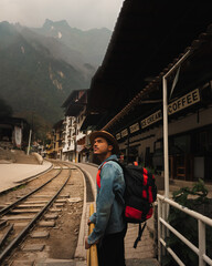 Man on the railway posing with montains