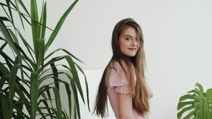 Fototapeta premium Portrait of attractive beautiful young woman model looking at camera
