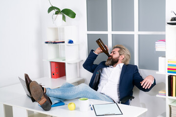 Tired bored businessman yawning at workplace near laptop, boring work, dead end job, overwork extra...
