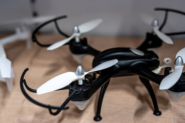 Dark drone on a wooden background. Selective focus 