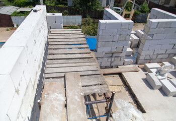 Construction of the walls of the house from foam concrete bricks.