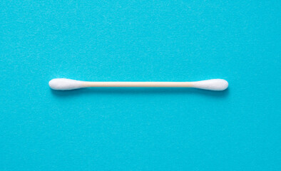 Bamboo swabs on a blue background