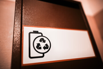 Black and white battery recycling sign