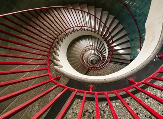 Fotobehang Trappen spiral staircase  with red railing  © Agata Kadar