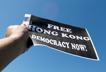 Protester are seen holding up banners during a rally in Hong Kong.
