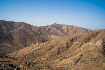 Fototapeta na wymiar View of the mountain landscape from the Risco de las Penas viewpoint. Fuerteventura. Canary Islands. Spain.