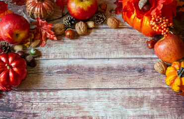 a layout of Thanksgiving pumpkins, nuts, leaves and pinecones