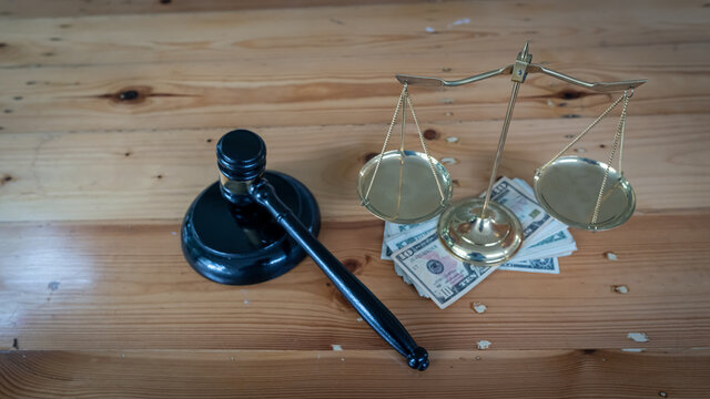 Gold scales were placed on silver, and the hammer of justice was on the wooden table.
