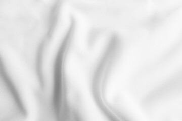White abstract wavy clothes background. fabric texture