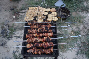 barbecue and grilled potatoes outside