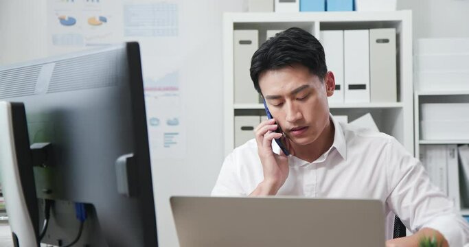 asian man speak on smartphone