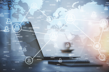 Computer on desktop with social network hologram. Double exposure. Concept of international people connections.