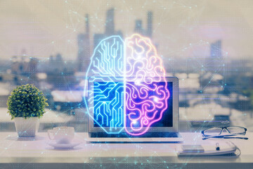 Double exposure of desktop with computer and brain drawing hologram. Artificial intelligence...