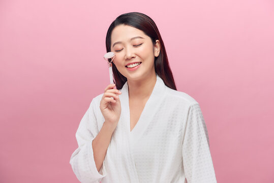 Woman Uses Jade Roller For Facial Massage