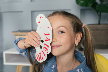 Little school kid learning numbers and to count at home