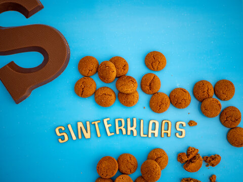 Dutch fest Sinterklaas concept with a large chocolate letter and candy called pepernoten. Room for copy. 