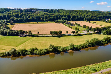 Fototapeta na wymiar Aerial view of fields and meadows on the banks of the river Weser near Beverungen, Germany