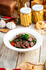 Closeup on roasted beef meat with vegetables