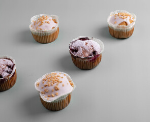 yummy sweet tasty muffin cakes on simple mono color background