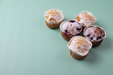 yummy sweet tasty muffin cakes on simple mono color background