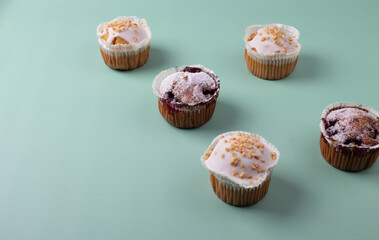 yummy sweet tasty muffin cakes on simple mono color background