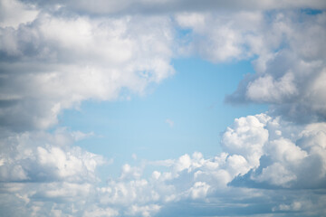 white cumulus clouds in the blue sky