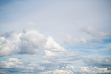 white cumulus clouds in the blue sky