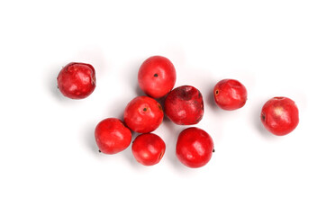Red or pink peppercorns on board, closeup photo isolated with white background