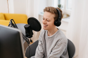 Young teenage boy recording a podcast