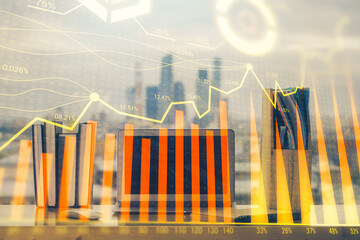 Forex market chart hologram and personal computer background. Double exposure. Concept of investment.