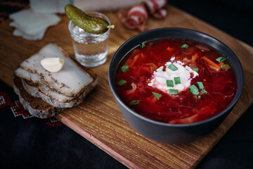 Traditional ukrainian cuisine. Bowl with tasty red borscht soup.