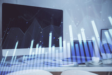 Forex Chart hologram on table with computer background. Double exposure. Concept of financial markets.