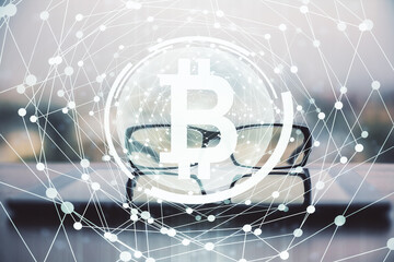 Crypto theme hologram with glasses on the table background. Concept of blockchain. Double exposure.