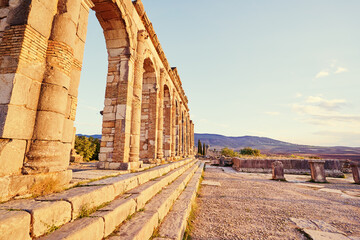 Beautiful sunset lanscape. The ancient antigue roman city Volubilis in Morocco, Africa.