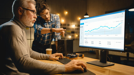Professional Senior Business Martket Analyst Works on Desktop Computer Working with Charts, Graphs,...