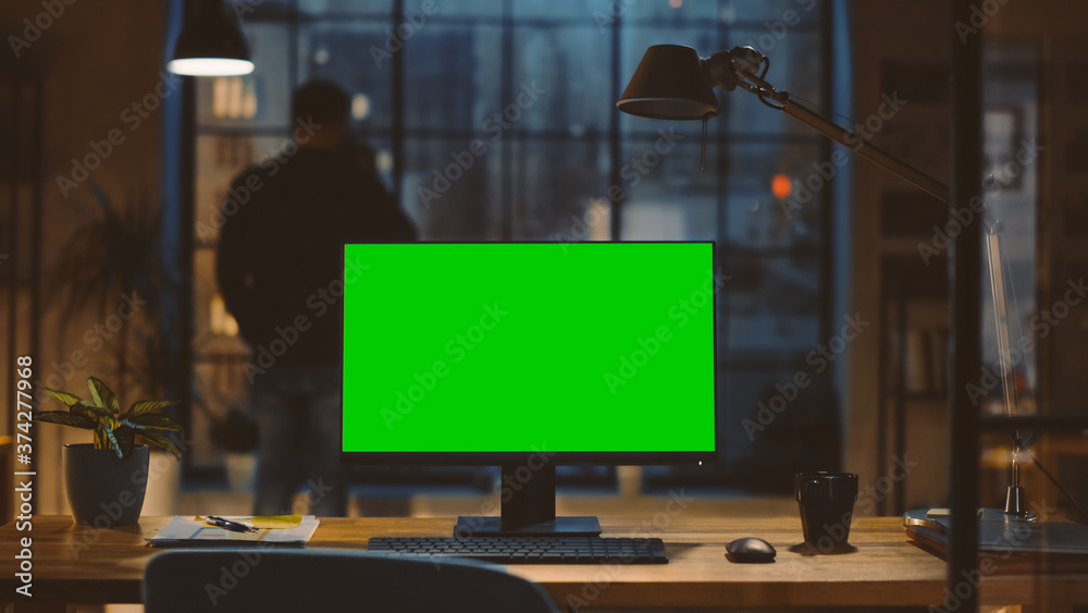 Aufkleber desktop computer with mock-up green screen standing on the desk in the modern creative office. in th